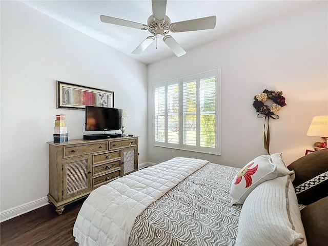 bedroom featuring dark wood-type flooring and ceiling fan