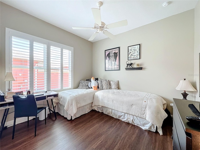 bedroom featuring dark hardwood / wood-style floors and ceiling fan