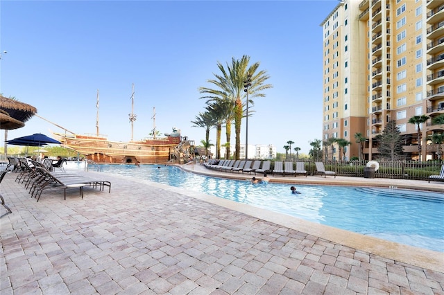 view of swimming pool featuring a patio area