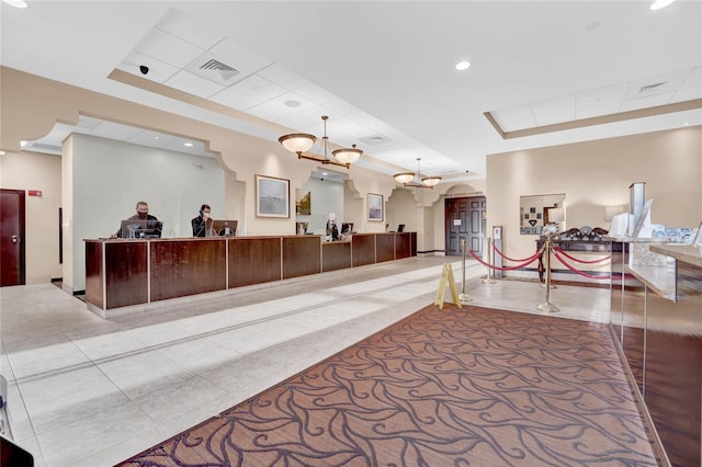 reception area featuring a chandelier