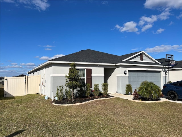 ranch-style home with a garage and a front lawn