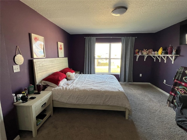 carpeted bedroom featuring a textured ceiling