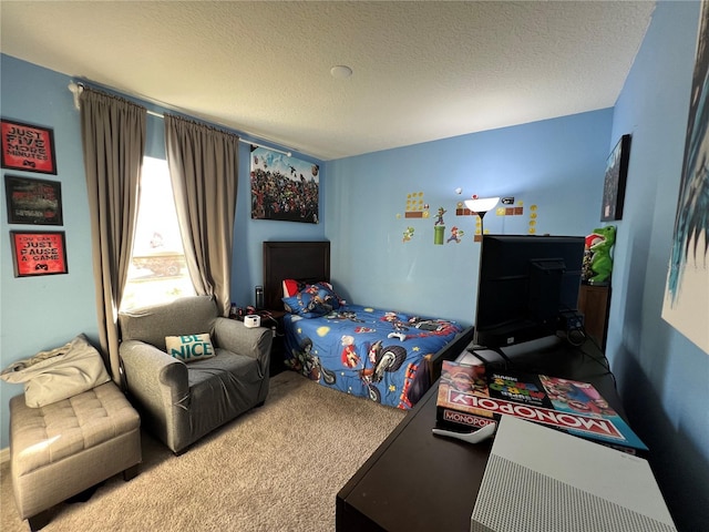 carpeted bedroom with a textured ceiling