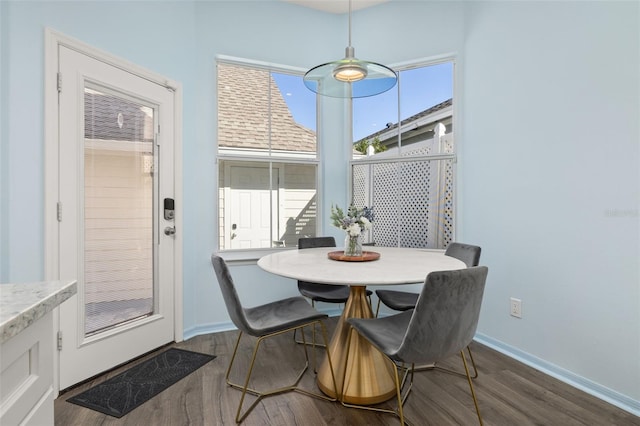 dining space with dark wood-type flooring