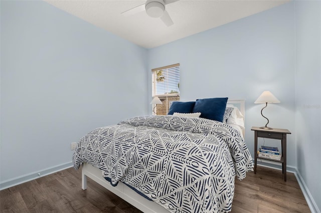 bedroom with hardwood / wood-style floors and ceiling fan