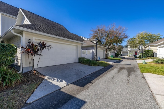 view of property exterior with a garage