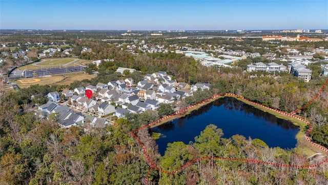 birds eye view of property with a water view