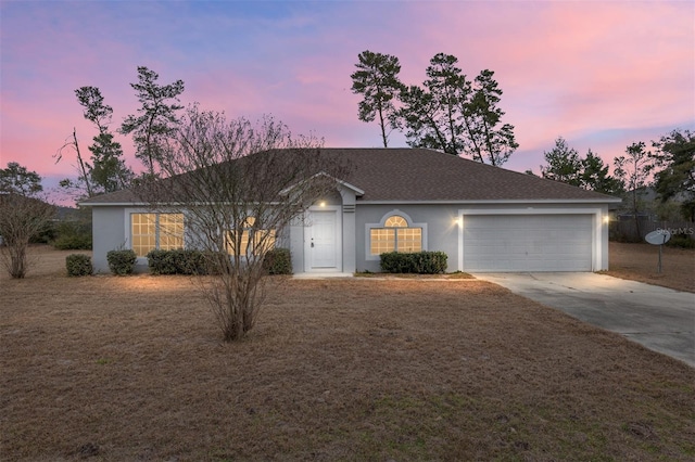 ranch-style home with a garage