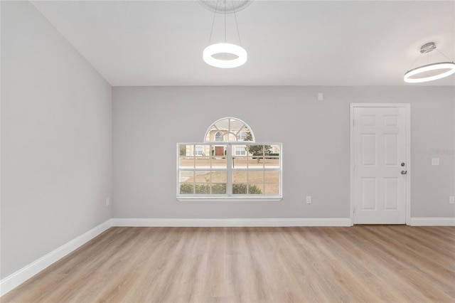 unfurnished room with light hardwood / wood-style flooring