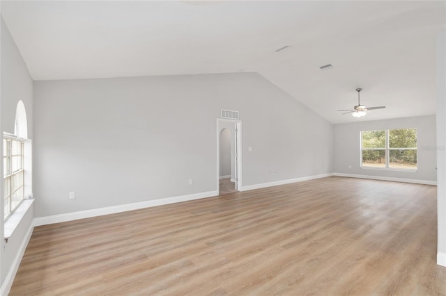 unfurnished living room with light hardwood / wood-style flooring, ceiling fan, and vaulted ceiling