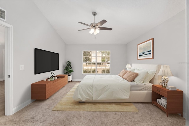 carpeted bedroom featuring lofted ceiling and ceiling fan