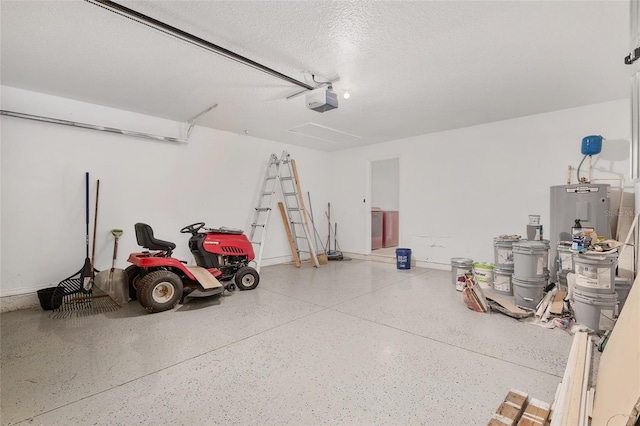 garage featuring water heater and a garage door opener