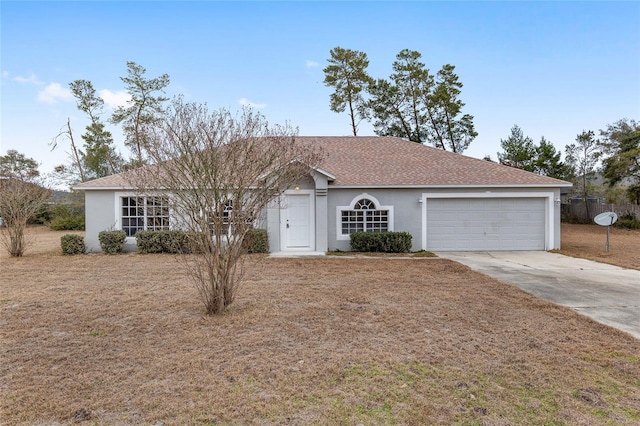 single story home with a garage