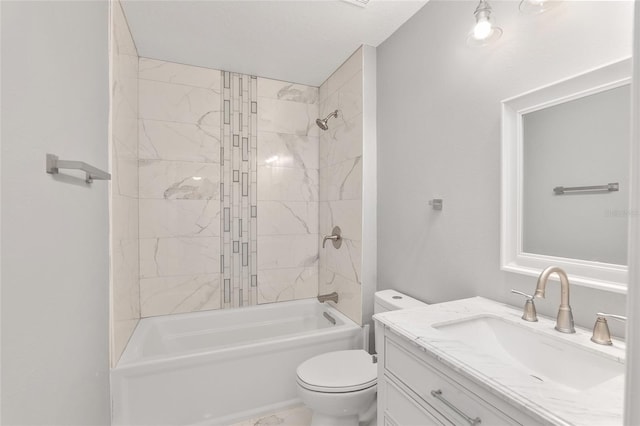 full bathroom with vanity, tiled shower / bath combo, and toilet