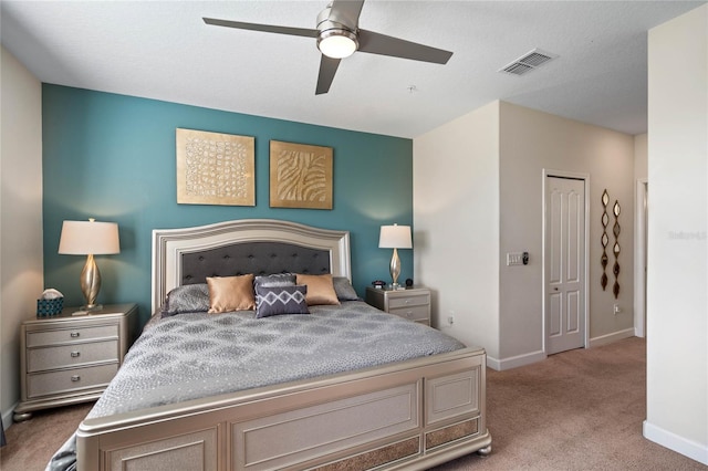 carpeted bedroom with ceiling fan