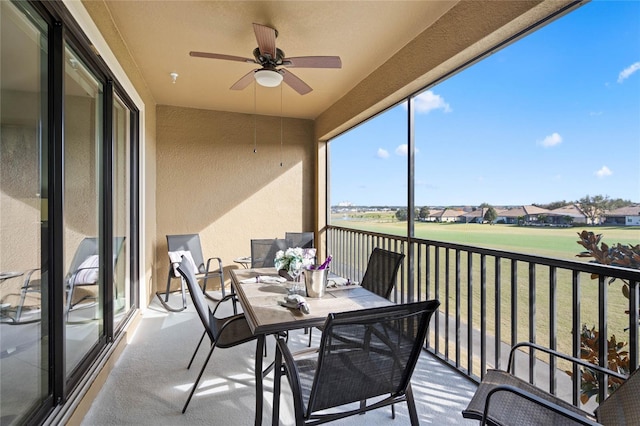 sunroom / solarium with ceiling fan