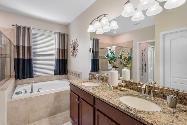 bathroom featuring vanity, tile patterned floors, and shower with separate bathtub