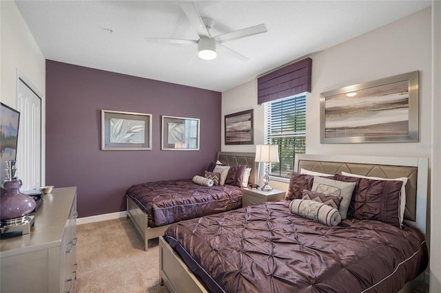 bedroom featuring ceiling fan and light colored carpet