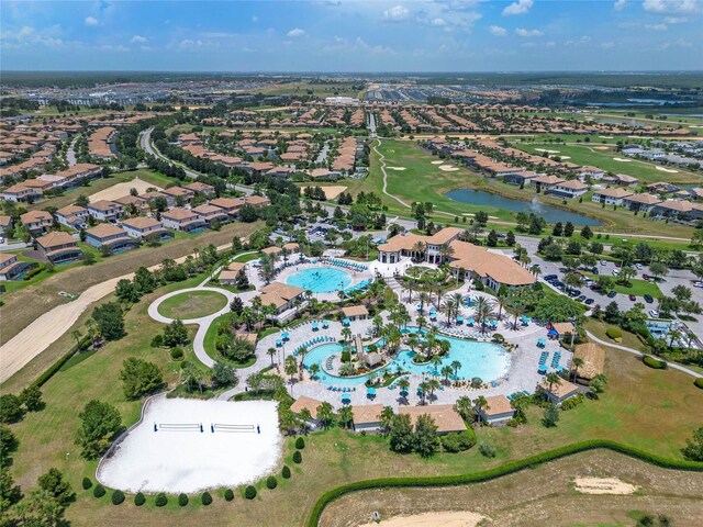 birds eye view of property with a residential view and a water view