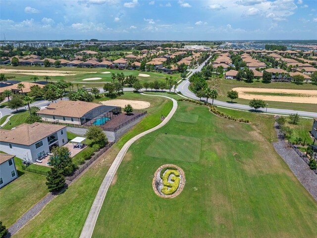 aerial view with view of golf course and a residential view