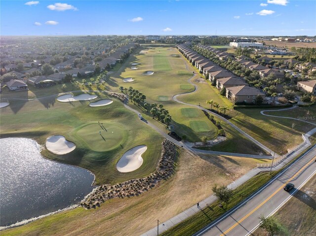 drone / aerial view featuring golf course view and a residential view