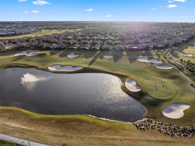 birds eye view of property with a residential view, golf course view, and a water view