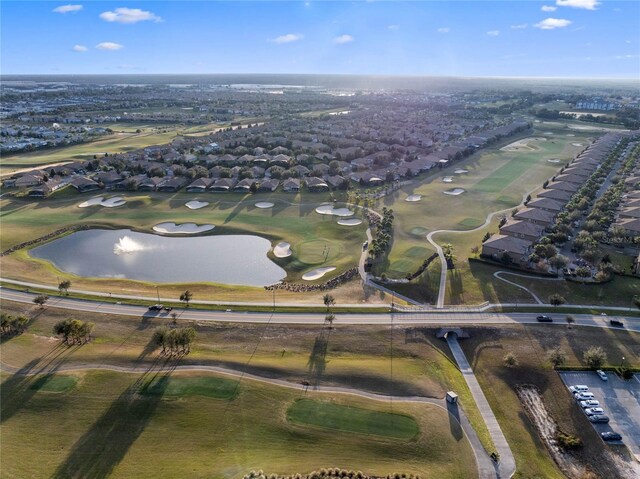 bird's eye view featuring a water view and golf course view