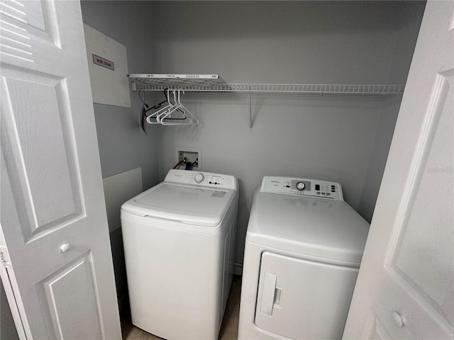 laundry area featuring washing machine and clothes dryer