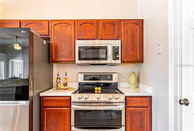 kitchen featuring appliances with stainless steel finishes and ceiling fan