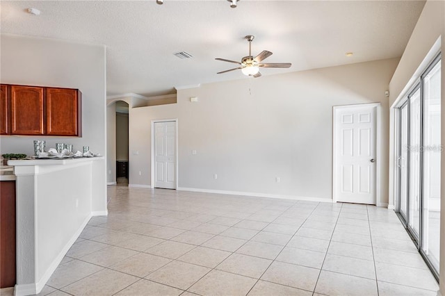 interior space with ceiling fan and light tile patterned floors