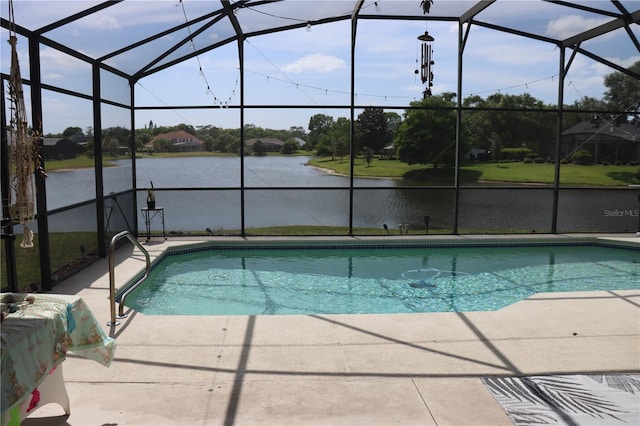 6002 Renaissance Ct, Saint Cloud, FL 34772 - outdoor pool featuring a patio, glass enclosure, and a water view