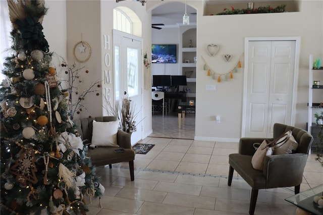 6002 Renaissance Ct, Saint Cloud, FL 34772 - foyer with light tile patterned floors and ceiling fan
