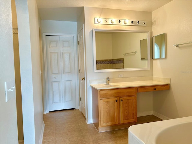 bathroom with vanity and tile patterned flooring