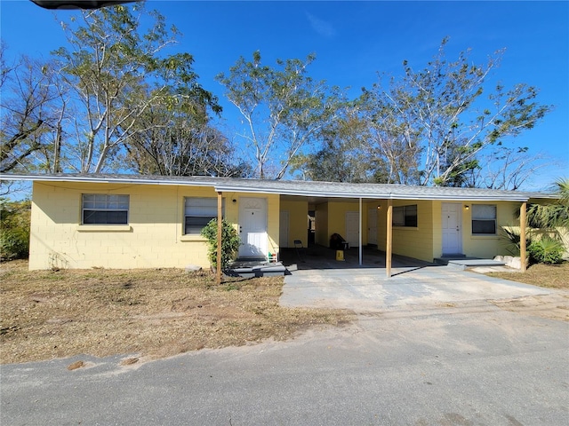 single story home with a carport