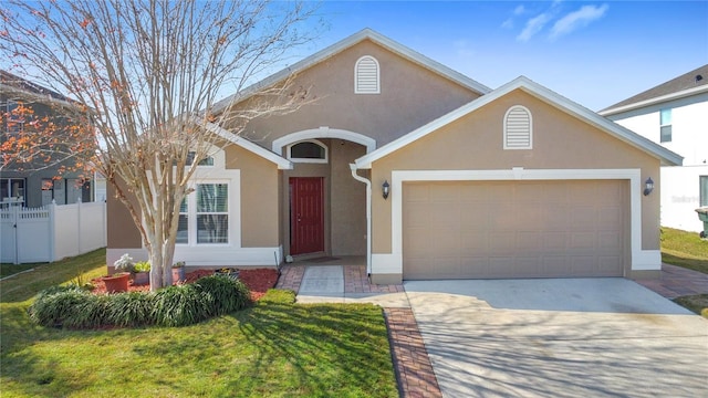 view of front of home with a garage and a front yard