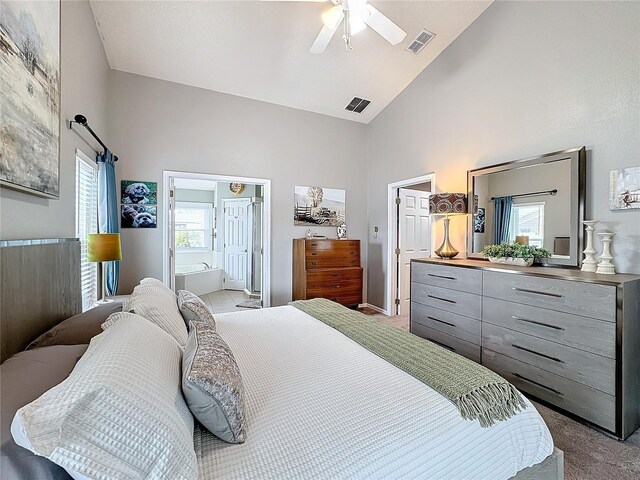 bedroom with high vaulted ceiling, visible vents, and light colored carpet