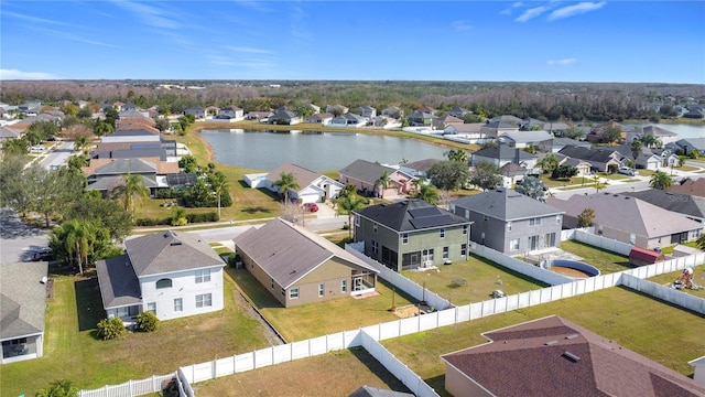 birds eye view of property featuring a water view and a residential view