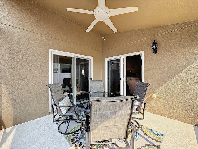 view of patio / terrace with a ceiling fan and outdoor dining area