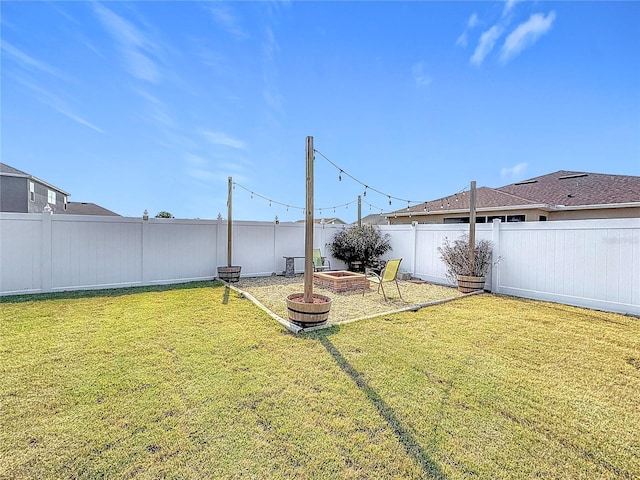 view of yard with an outdoor fire pit and a fenced backyard