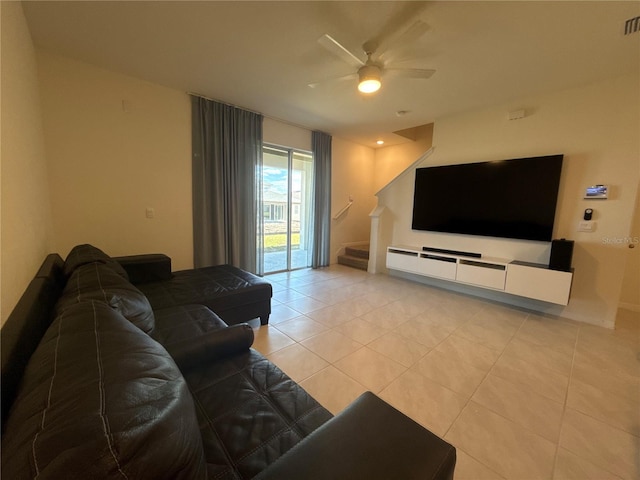 living room with light tile patterned flooring and ceiling fan