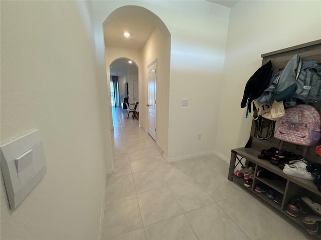 hall with light tile patterned flooring