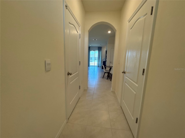 hallway featuring light tile patterned flooring