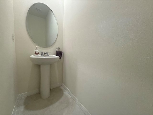 bathroom with sink and tile patterned floors