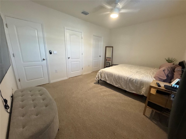 bedroom with ceiling fan and carpet