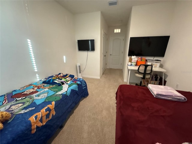 bedroom with light colored carpet