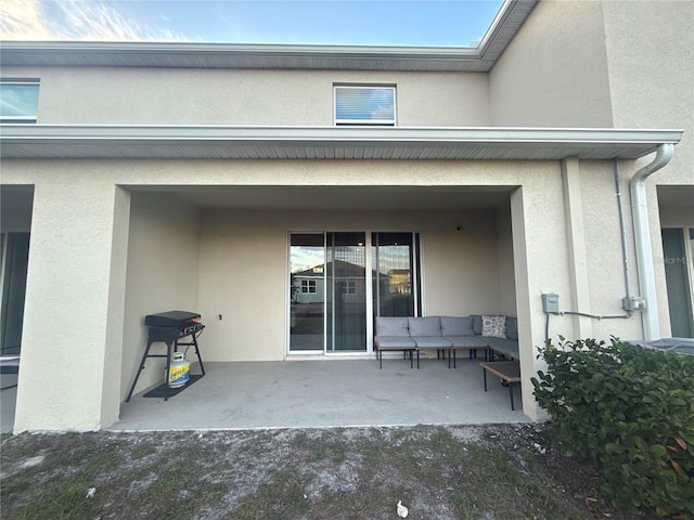 view of patio with area for grilling and outdoor lounge area