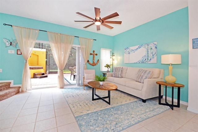 tiled living room with ceiling fan