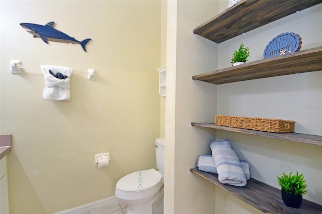 bathroom with vanity, tile patterned floors, and toilet