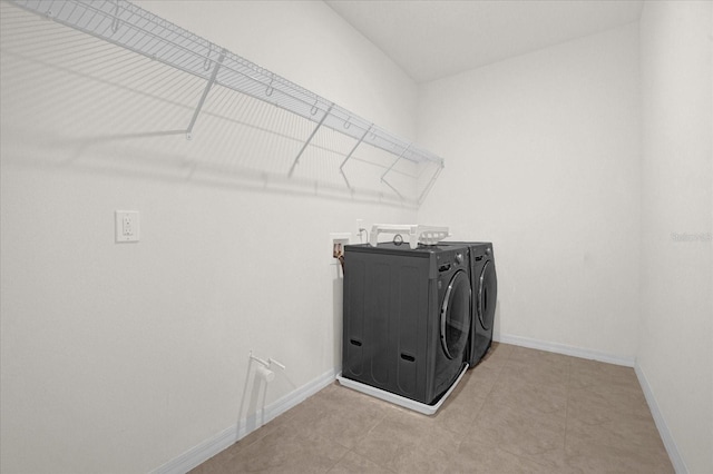 laundry area with independent washer and dryer