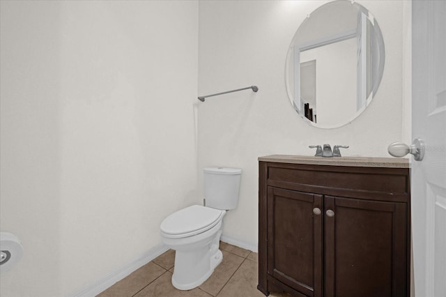 bathroom with tile patterned floors, toilet, and vanity